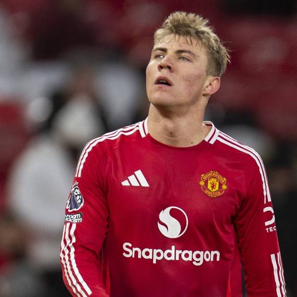 epa11790142 Rasmus Hojlund of Manchester United and Robbie Mainoo of Manchester United after losing the English Premier League soccer match between Manchester United and AFC Bournemouth, in Manchester ...