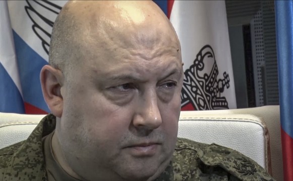 epa10251484 A still image taken from a handout video provided by the Russian Defence ministry press-service shows the Russian Joint Group of Forces Commander Surovikin speaking with journalists in Mos ...