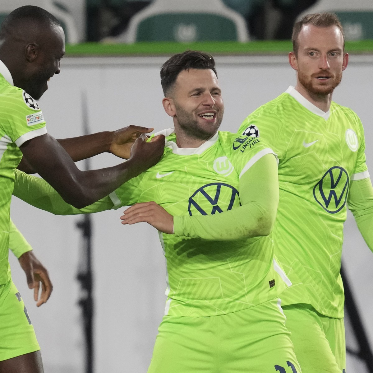 Wolfsburg's Renato Steffen center, celebrates after scoring his side's opening goal during the Champions League group G soccer match between VfL Wolfsburg and Sevilla in Wolfsburg, Germany,  ...