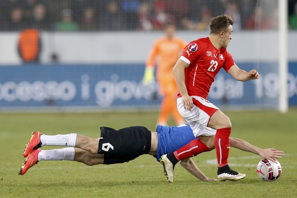 Switzerland&#039;s Xherdan Shaqiri, right, fights for the ball against Estonia&#039;s midfielder Aleksandr Dmitrijev during the UEFA EURO 2016 qualifying football match Switzerland against Estonia at  ...