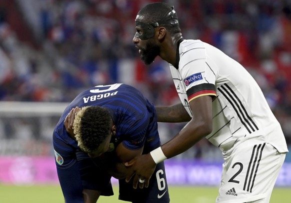 Germany&#039;s Antonio Ruediger, right, stands beside France&#039;s Paul Pogba during the Euro 2020 soccer championship group F match between France and Germany at the Allianz Arena stadium in Munich, ...