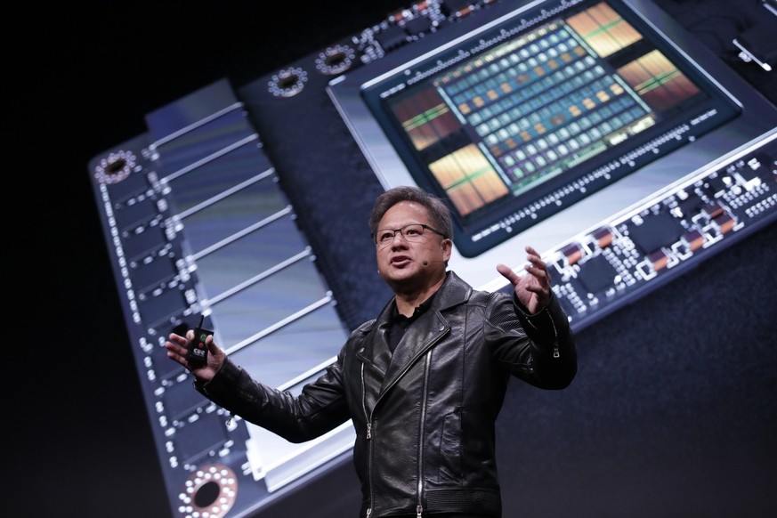 epa06772176 Nvidia president and CEO Jensen Huang speaks during the Annual GPU Technology conference in Taipei, Taiwan, 30 May 2018. Huang discussed Advance computing, Artificial intelligence and new  ...