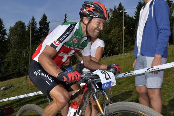 Swiss Cyclist Ralph Naef speeds down the track to reach the 10th place of the Men&#039;s Elite Cross Country, CX, UCI Mountain Bike, MTB, World Championships in Hafjell, Norway, Saturday September 6,  ...