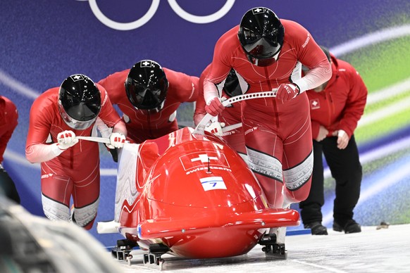 KEYPIX - epa12764245 Michael Vogt, Andreas Haas, Amadou David Ndiaye, and Mario Aeberhard of Switzerland in action during the 4-Man of the Bobsleigh competitions at the Milano Cortina 2026 Winter Olym ...