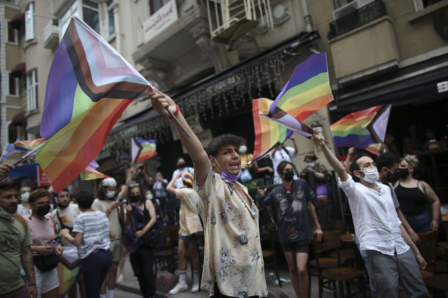 Protesters chants slogans, during a pride event in central Istanbul, Saturday, June 26, 2021. Police used tear gas to disperse the crowds and detained dozens of LGTBI activists as hundreds defied a ba ...