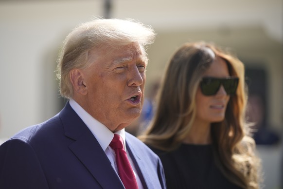 Former President Donald Trump talks to the media with Melania Trump, after voting at Morton and Barbara Mandel Recreation Center on Election Day, Tuesday, Nov. 8, 2022, in Palm Beach, Fla. (AP Photo/A ...