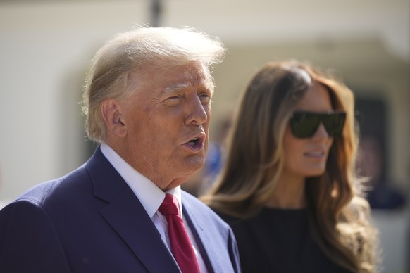 Former President Donald Trump talks to the media with Melania Trump, after voting at Morton and Barbara Mandel Recreation Center on Election Day, Tuesday, Nov. 8, 2022, in Palm Beach, Florida.  (AP Photo/A...