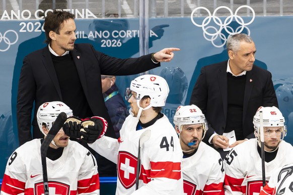Patrick Fischer, left, head coach of Switzerland national ice hockey team, gestures next to Jan Cadieux, right, assistant coach of Switzerland national ice hockey team, during the men's ice hocke ...
