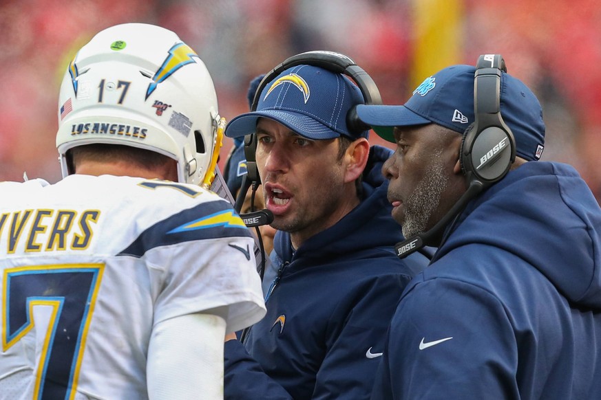 KANSAS CITY, MO - DECEMBER 29: Los Angeles Chargers offensive coordinator Shane Steichen, head coach Anthony Lynn and quarterback Philip Rivers 17 huddle during a timeout in an AFC West game between t ...