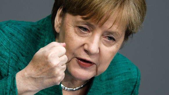 epa06846356 German Chancellor Angela Merkel delivers a speech to the German Bundestag in Berlin, Germany, 28 June 2018. Merkel delivered a government declaration to the members of the German parliamen ...