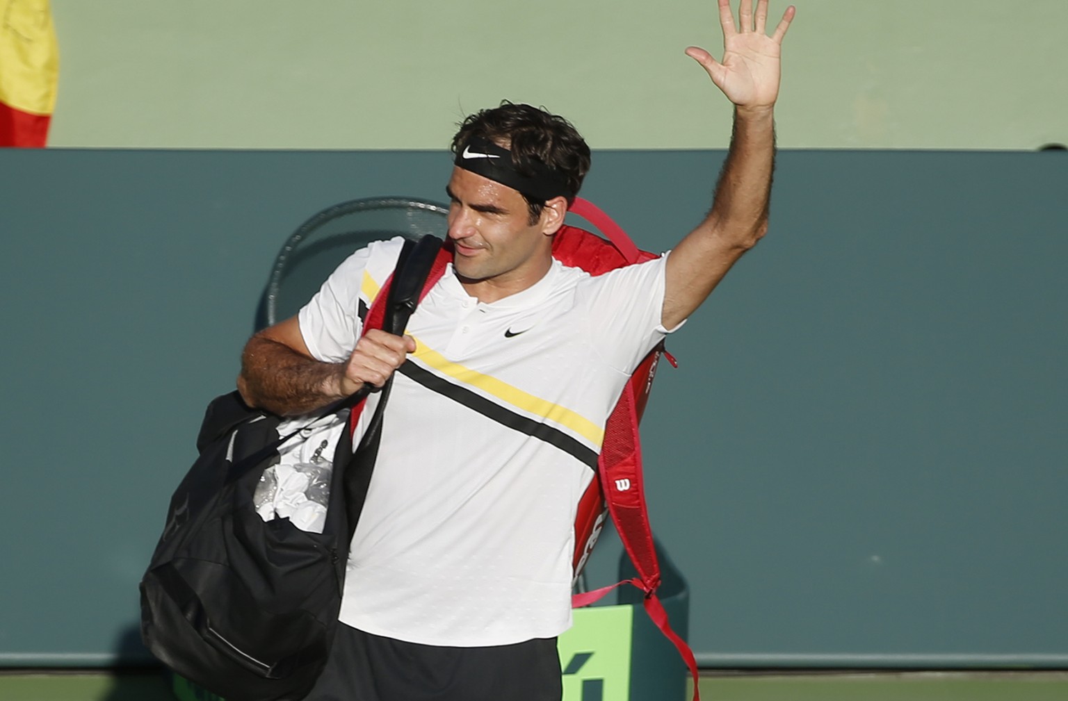 Roger Federer, of Switzerland, waves to the crowd after Thanasi Kokkinakis, of Australia, defeated him in a tennis match at the Miami Open, Saturday, March 24, 2018, in Key Biscayne, Fla. (AP Photo/Wi ...