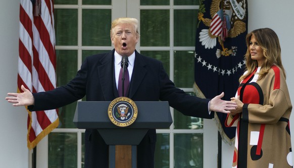 President Donald Trump, joined by first lady Melania Trump, speaks during a ceremony to pardon the National Thanksgiving Turkey in the Rose Garden of the White House in Washington, Tuesday, Nov. 20, 2 ...