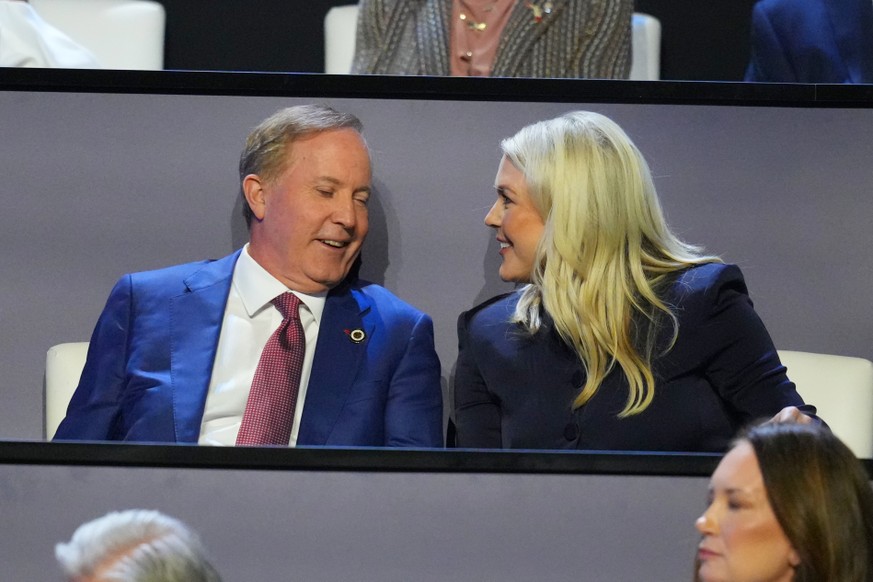 Republican U.S. Senate candidate Texas Attorney General Ken Paxton speaks with former White House press secretary Karoline Leavitt at the Republican convention Thursday, Sept. 10, 2026, in Dallas. (AP ...
