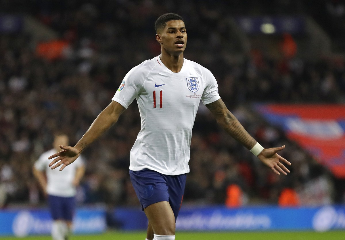England's Marcus Rashford celebrates scoring his side's fourth goal during the Euro 2020 group A qualifying soccer match between England and Montenegro at Wembley stadium in London, Thursday ...