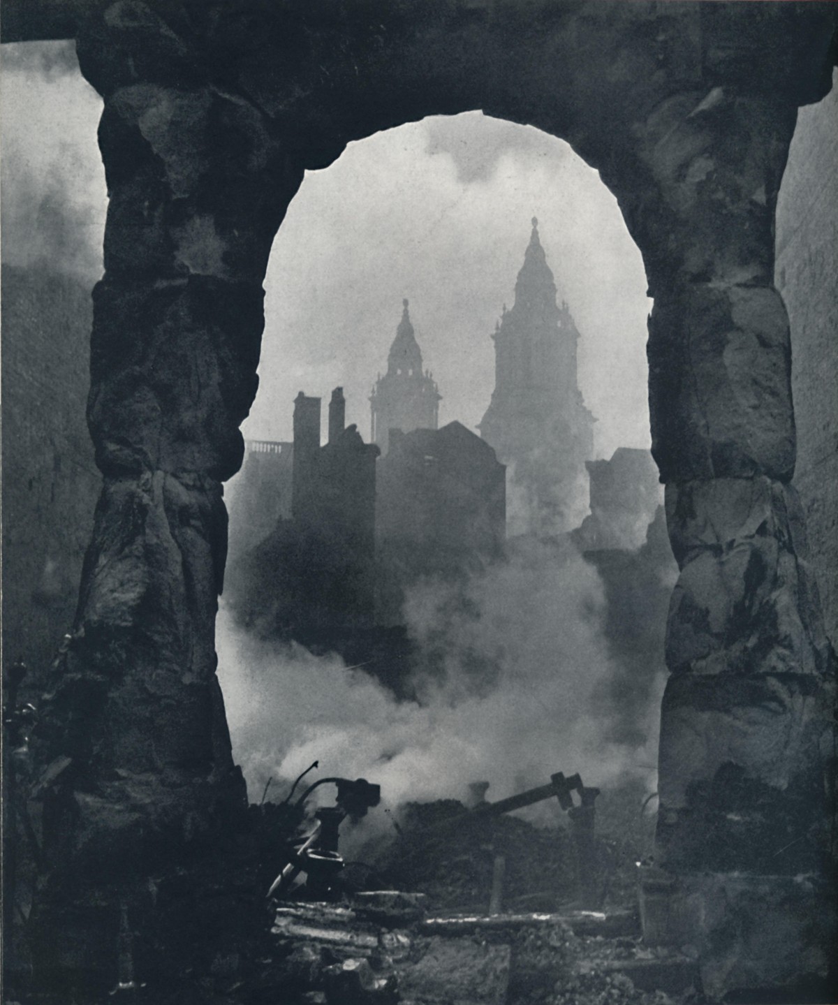 'Apocalypse', 1941. The twin clock towers of St Pauls Cathedral is seen through the bomb damage. From Air of Glory, by Cecil Beaton. [His Majesty's Stationery Office, London, 1941] Arti ...