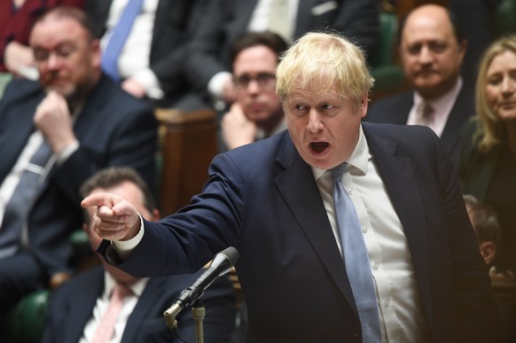 In this photo made available by UK Parliament, Britain&#039;s Prime Minister Boris Johnson speaks in the Houses of Commons, London, Monday Jan. 31, 2022. Boris Johnson apologized for lockdown-flouting ...