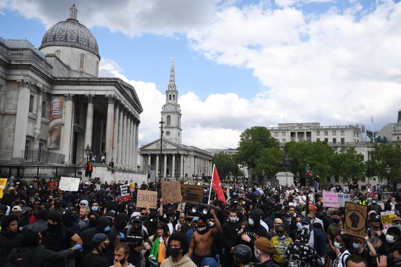 epa08483067 Protesters gather in Trafalgar Square during a Black Lives Matter (BLM) demonstration in London, Britain, 13 June 2020. Protesters gathered to express their feelings about the killing of G ...