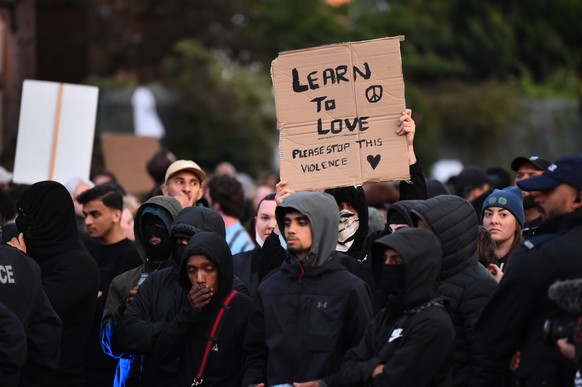 epa11534948 Anti-racist protesters gather outside the Merseyside Refugee Centre in Liverpool, Britain, 07 August 2024. Further far-right protests are expected throughout Britain on the 07 August 2024. ...