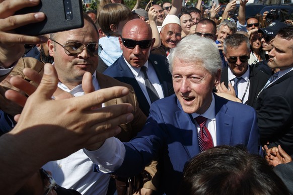 epa07643740 Former US president Bill Clinton greets Kosovan Albanians during the ceremony marking the 20th anniversary of ending the war in Pristina, Kosovo, 12 June 2019. Thousands of Kosovan Albania ...