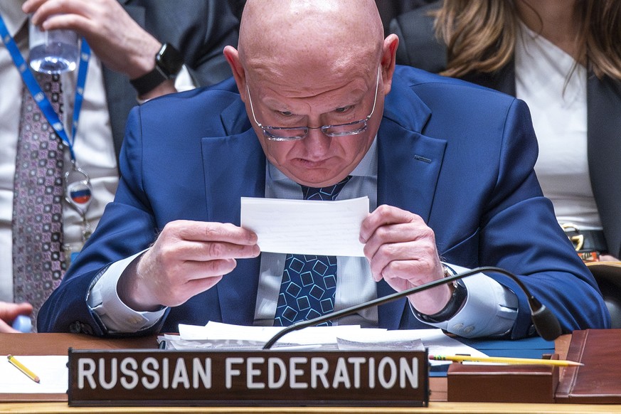 Russian Permanent Representative to the UN Vassily Nebenzia reads a note as he attends a meeting on Non-proliferation of nuclear weapons with members of the U.N. Security Council , Wednesday, April 24 ...