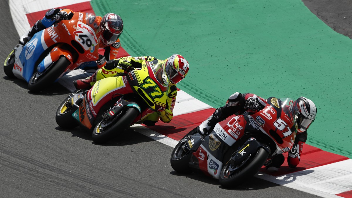 Moto2 Kalex rider Edgar Pons of Spain, leads KTM rider Dominique Aegerter of Switzerland and Augusto Fernandez of Spain during the Catalunya Motorcycle Grand Prix at the Barcelona Catalunya racetrack  ...