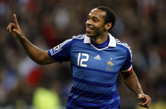 FILE - In this Wednesday Oct. 14, 2009 file photo, France&#039;s Captain Thierry Henry celebrates after scoring a penalty against Austria during their World Cup 2010 qualifying soccer match at Stade d ...