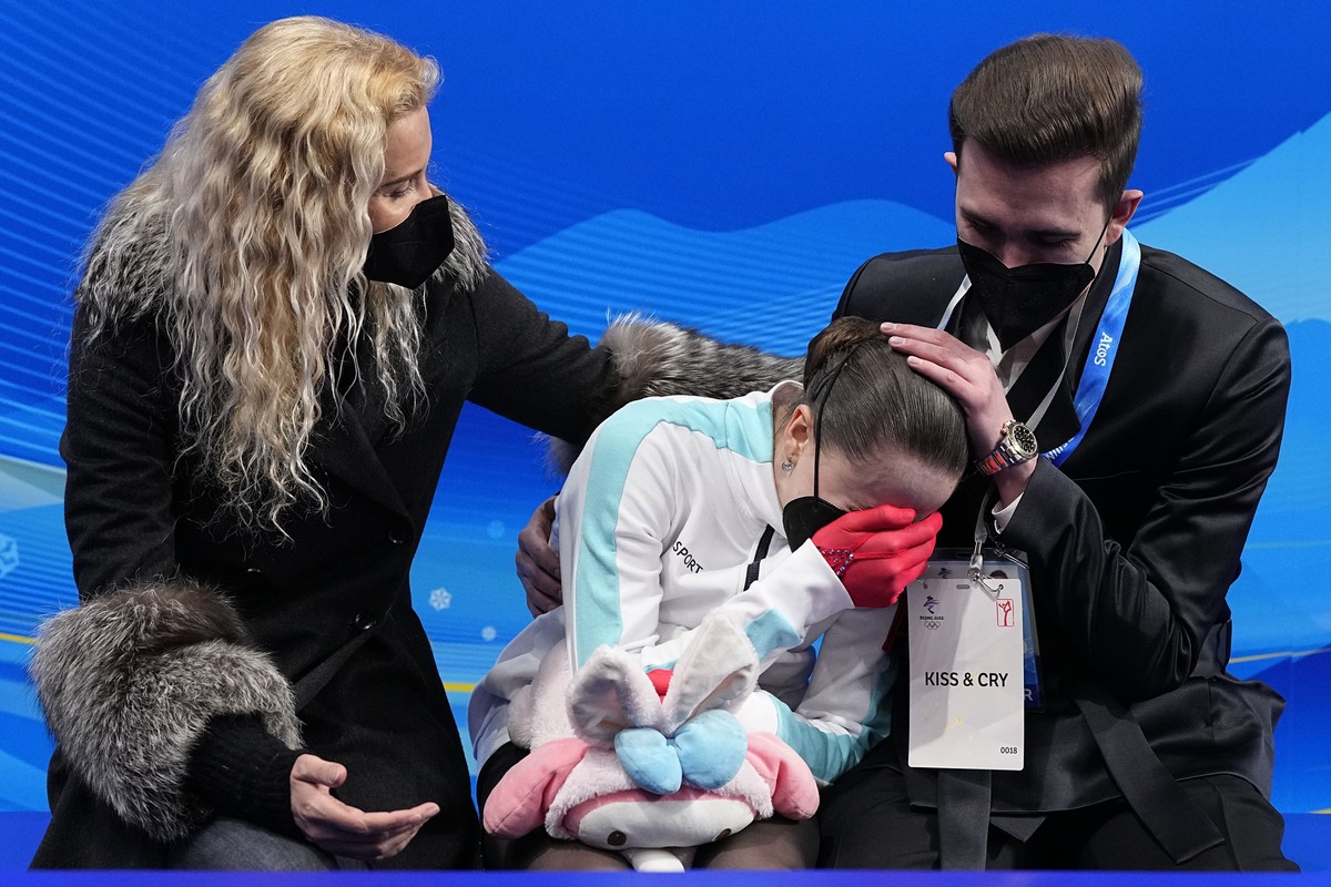 Kamila Valieva, of the Russian Olympic Committee, reacts after competing in the women's free skate program during the figure skating competition at the 2022 Winter Olympics, Thursday, Feb. 17, 20 ...