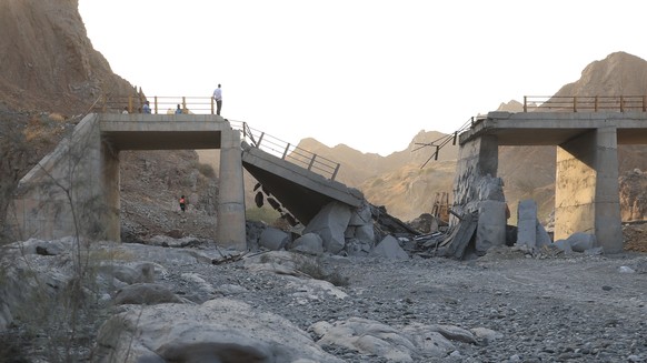 People stand on a bridge destroyed after a strike in Hormozgan province, southern Iran, Saturday, July 18, 2026. (Amirhosein Khorgooi/Iranian Students' News Agency via AP)
Iran War