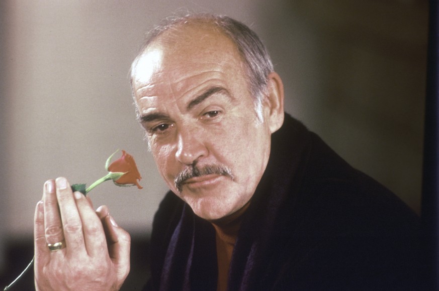FILE - In this Jan. 23, 1987 file photo, actor Sean Connery holds a rose in his hand as he talks about his new movie &quot;The Name of the Rose&quot; at a news conference in London. Scottish actor Sea ...