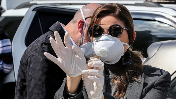 epa08255631 An anti-government protester wears a face mask during a protest in front of the Lebanese Ministry of Health under the slogan &#039;Our life is not a toy in your hands&#039; in Beirut, Leba ...