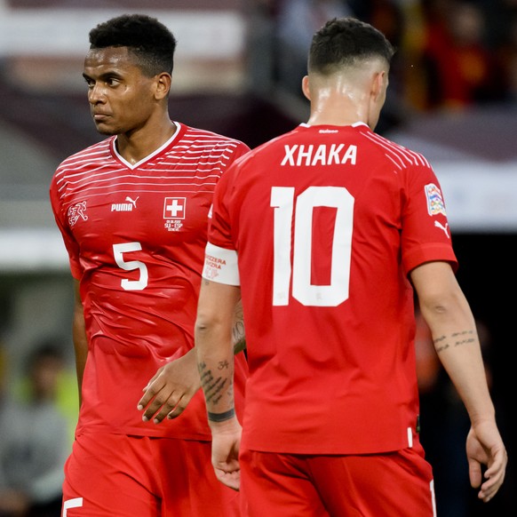 Switzerland's defender Manuel Akanji, left, and Switzerland's midfielder Granit Xhaka, right, react during the UEFA Nations League group A2 soccer match between Switzerland and Spain at the Stade de G ...