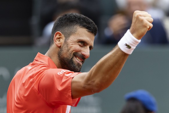 epa12123702 Novak Djokovic, of Serbia, reacts after winning a game against to Marton Fucsovics of Hungary, during the round of 16 at the Geneva Open tennis tournament, in Geneva, Switzerland, 21 May 2 ...