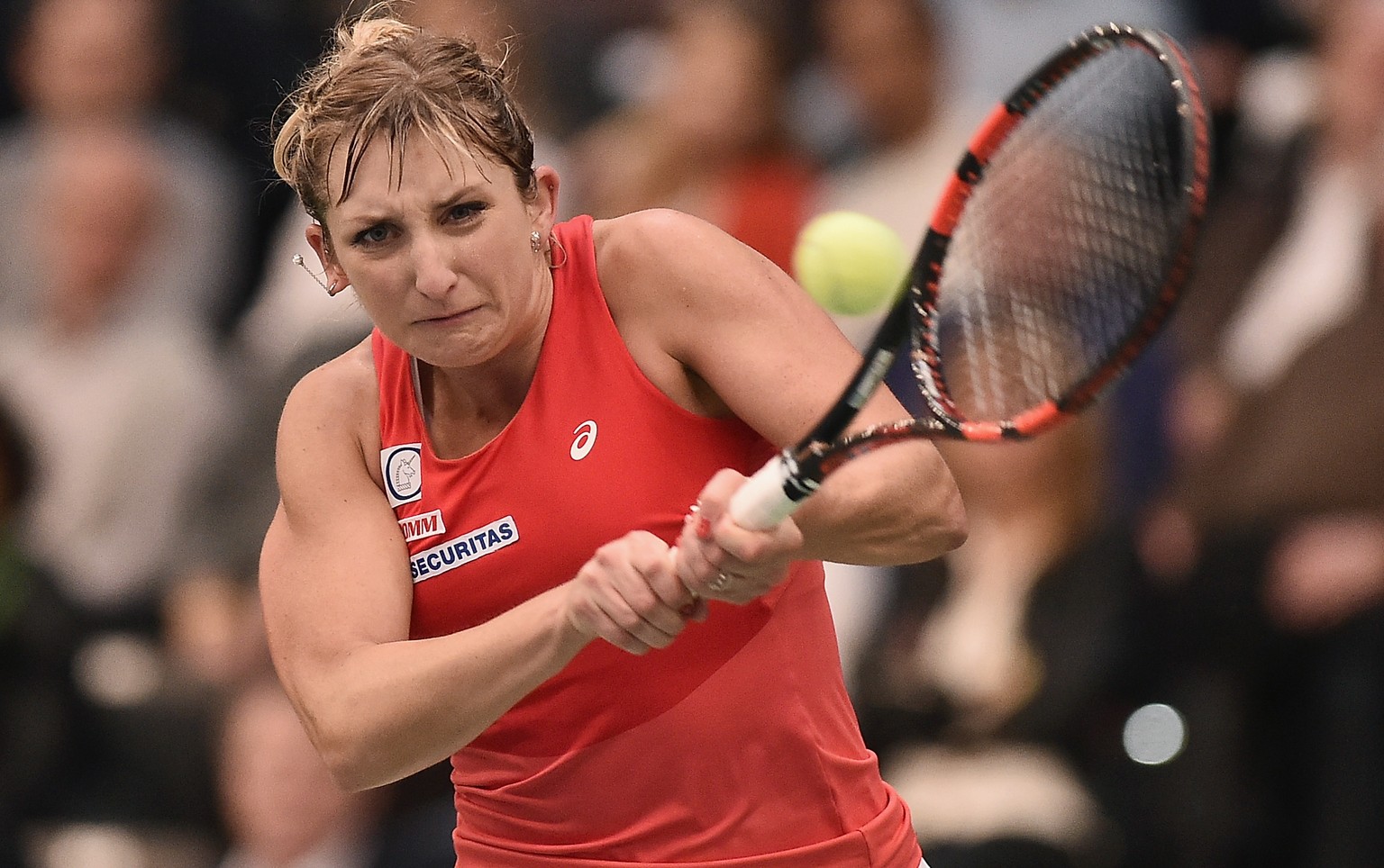 LEIPZIG, GERMANY - FEBRUARY 07: Timea Bacsinszky of Switzerland plays a backhand in her match against Annika Beck of Germany on Day 2 of the 2016 FedCup World Group Round 1 match between Germany and S ...