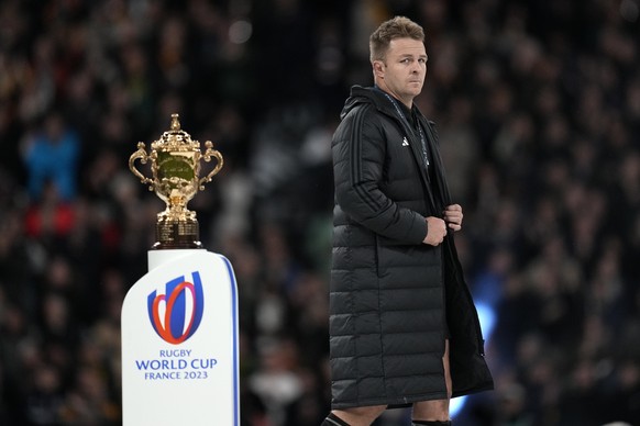 New Zealand&#039;s Sam Cane walks past the trophy during presentation ceremony after the Rugby World Cup final match between New Zealand and South Africa at the Stade de France in Saint-Denis, near Pa ...