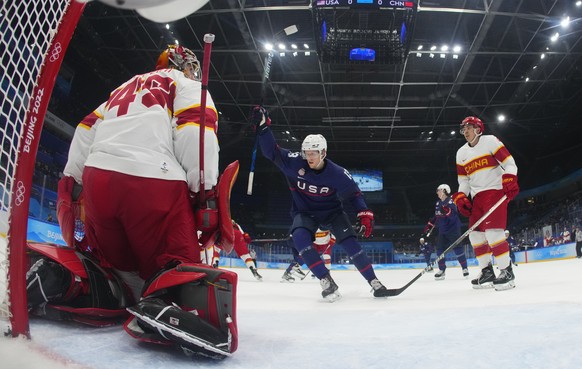United States' Nathan Smith, celebrates after teammate Brendan Brisson, not shown, scored a goal against China goalkeeper Jieruimi Shimisi (Jeremy Smith) (45) during a preliminary round men' ...