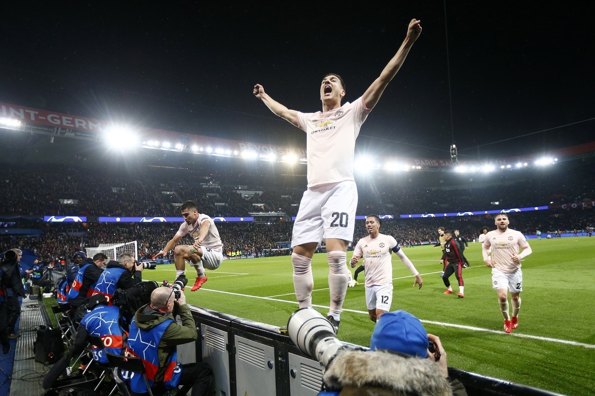 epa07418331 Manchester's Diogo Dalot celebrates after the UEFA Champions League round of 16 second leg soccer match between PSG and Manchester United at the Parc des Princes Stadium in Paris, Fra ...