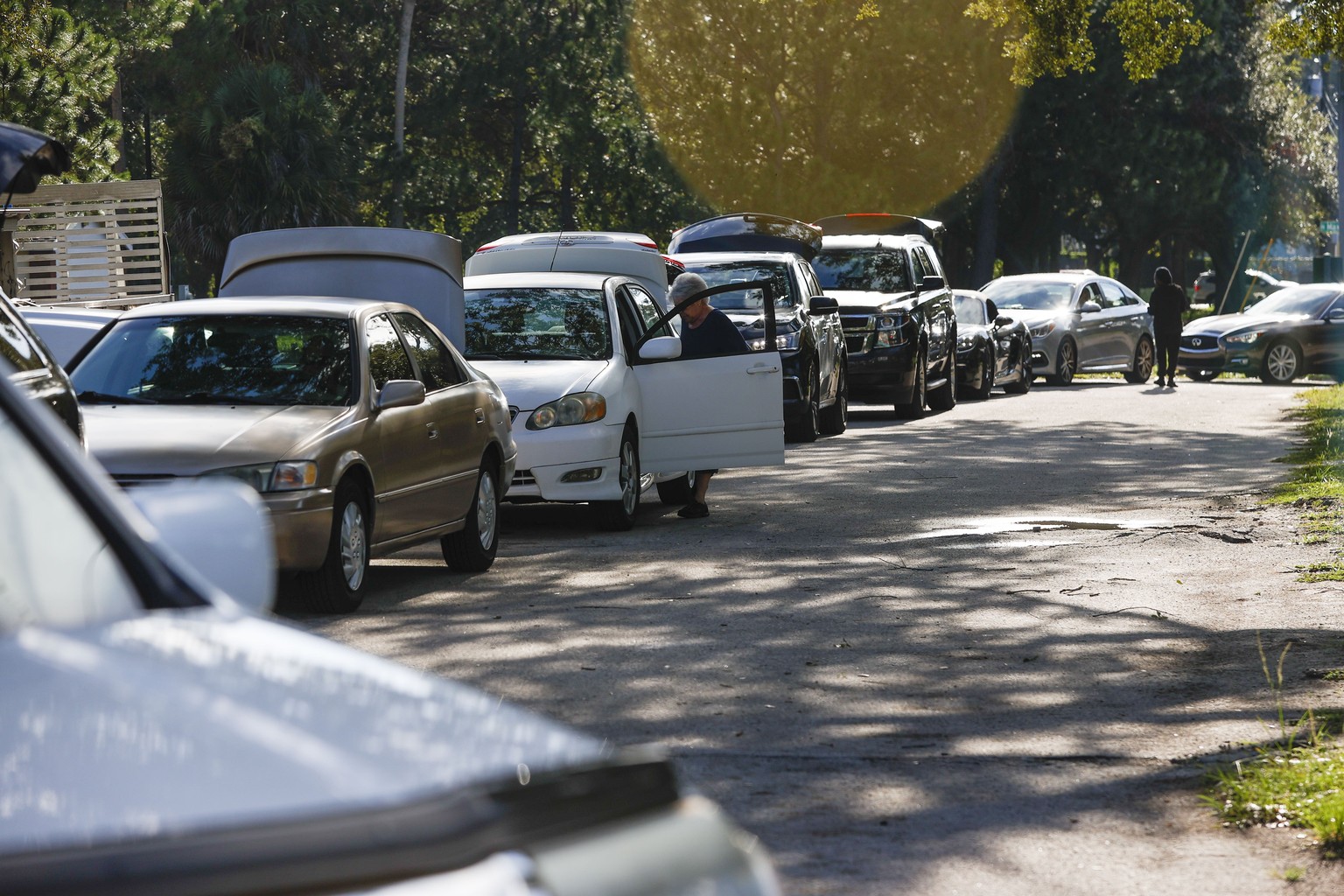 Motorists wait in line during sandbag distribution, ahead of Tropical Storm Idalia&#039;s arrival, at MacFarlane Park in Tampa, Fla., Monday, Aug. 28, 2023. (Ivy Ceballo/Tampa Bay Times via AP)