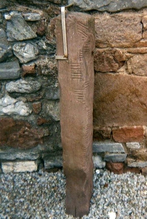 An example of an ogham stone in the ground of Ratass Church in Tralee, Co. Kerry

https://en.wikipedia.org/wiki/Ogham#/media/File:Ogham_Stone_Rathass_Church_Tralee_Kerry.jpg