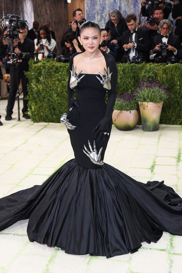 epa12933007 Thai fashion journalist Nichapat Suphap poses on the red carpet for the 2026 Met Gala, the annual benefit for the Metropolitan Museum of Art's Costume Institute, in New York, New York ...