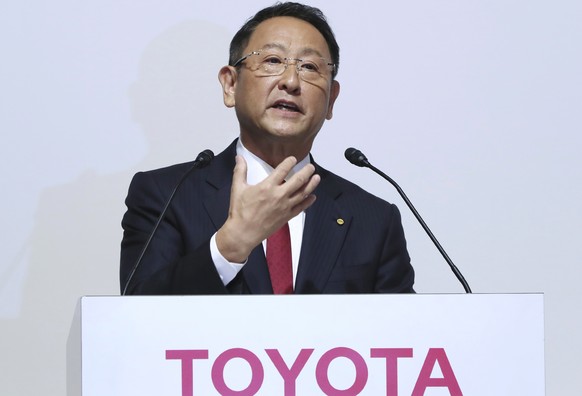 FILE - In this Aug. 4, 2017, file photo, Toyota Motor Corp. President Akio Toyoda answers a question during a joint press conference with Mazda Motor Corp. President Masamichi Kogai in Tokyo. A suicid ...