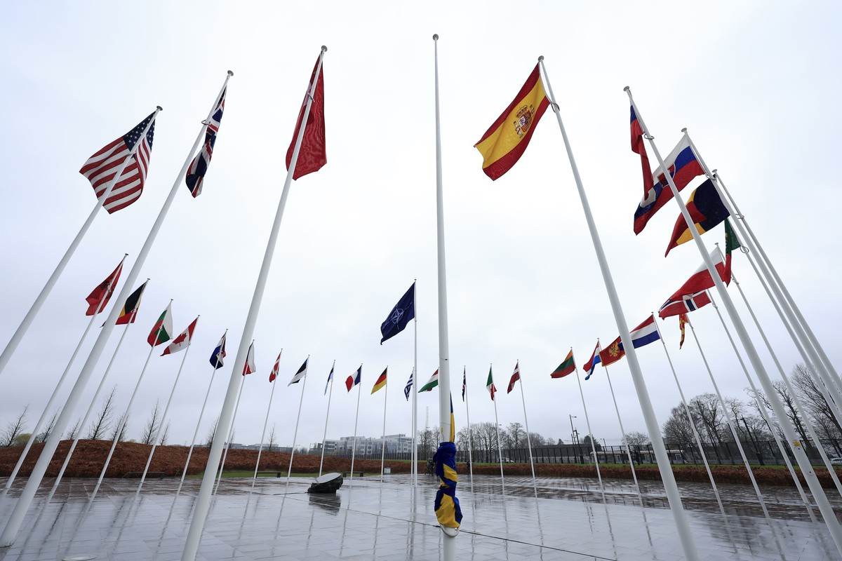 The Swedish flag is tied to a flagpole and surrounded by the flags of other NATO nations, as protocol prepare for a flag raising ceremony to mark the accession of Sweden at NATO headquarters in Brusse ...