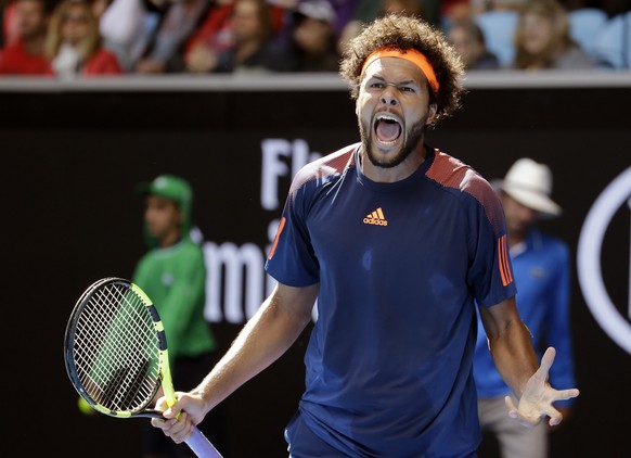 France&#039;s Jo-Wilfried Tsonga yells out while playing United States&#039; Jack Sock during their third round match at the Australian Open tennis championships in Melbourne, Australia, Friday, Jan.  ...