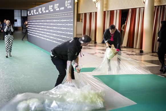 Staff prepare the Green Carpet for the Opening Night of the 18th Zurich Film Festival (ZFF) in Zurich, Switzerland, on Thursday, September 22, 2022. The Zurich Film Festival festival will run from Sep ...