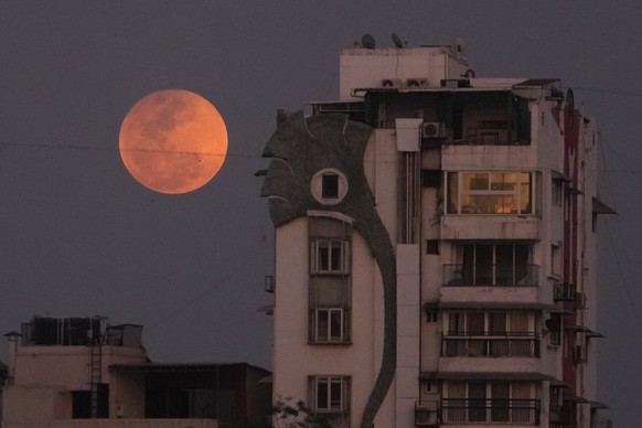 A blood moon rises over Ahmedabad, India, Tuesday, March 3, 2026. (AP Photo/Ajit Solanki)
India Lunar Eclipse