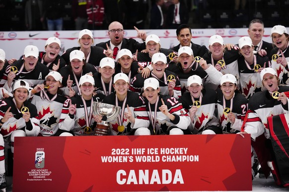 Canadian team poses with their gold medals after The IIHF World Championship Woman&#039;s ice hockey gold medal match between USA and Canada in Herning, Denmark, Sunday, Sept. 4, 2022. (Bo Amstrup/Rit ...