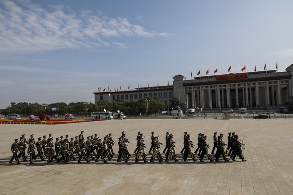 epa08707399 Members of military band leave after the flower-basket-laying ceremony for the monument to the people's heroes ahead of Chinese National Day at the Monument to the People's Heroes at Tiana ...