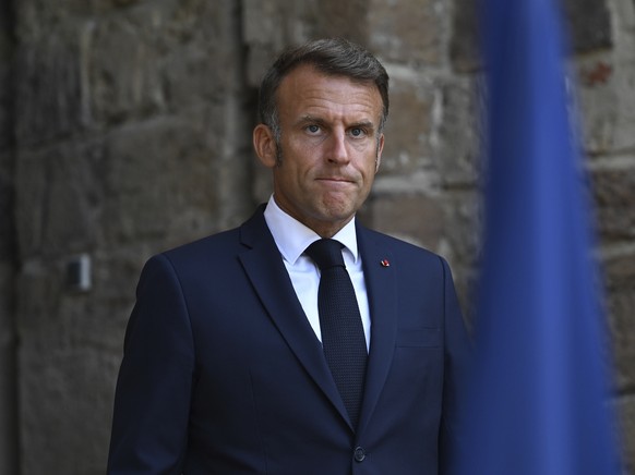 FILE - French President Emmanuel Macron arrives to speak after attending a video conference with members of the so-called &quot;coalition of the willing&quot;, Sunday, Aug. 17, 2025 at the Fort de Bre ...