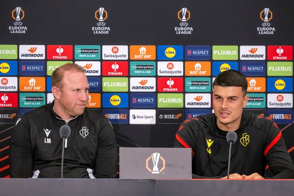 Basel&#039;s head coach Ludovic Magnin, left, and player Flavius Daniliuc speak during a press conference the day before their UEFA Europa League match between Switzerland&#039;s FC Basel 1893 and Rom ...