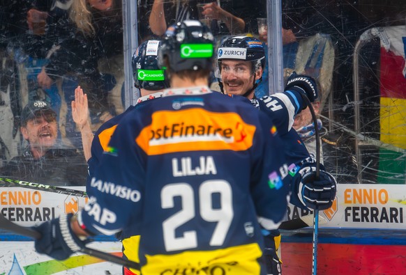 Ambri&#039;s player Laurent Dauphin right, celebrates the 2-0 goal with Ambri&#039;s player Dominik Zwerger, left, during the preliminary round game of National League Swiss Championship 2023/24 betwe ...