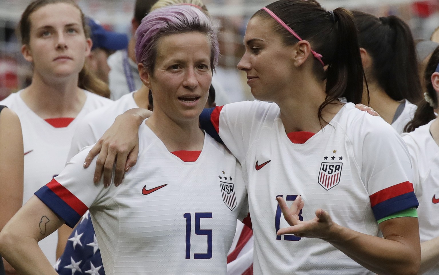 United States&#039; Megan Rapinoe, left, talks to her teammate Alex Morgan, right, after winning the Women&#039;s World Cup final soccer match between US and The Netherlands at the Stade de Lyon in De ...